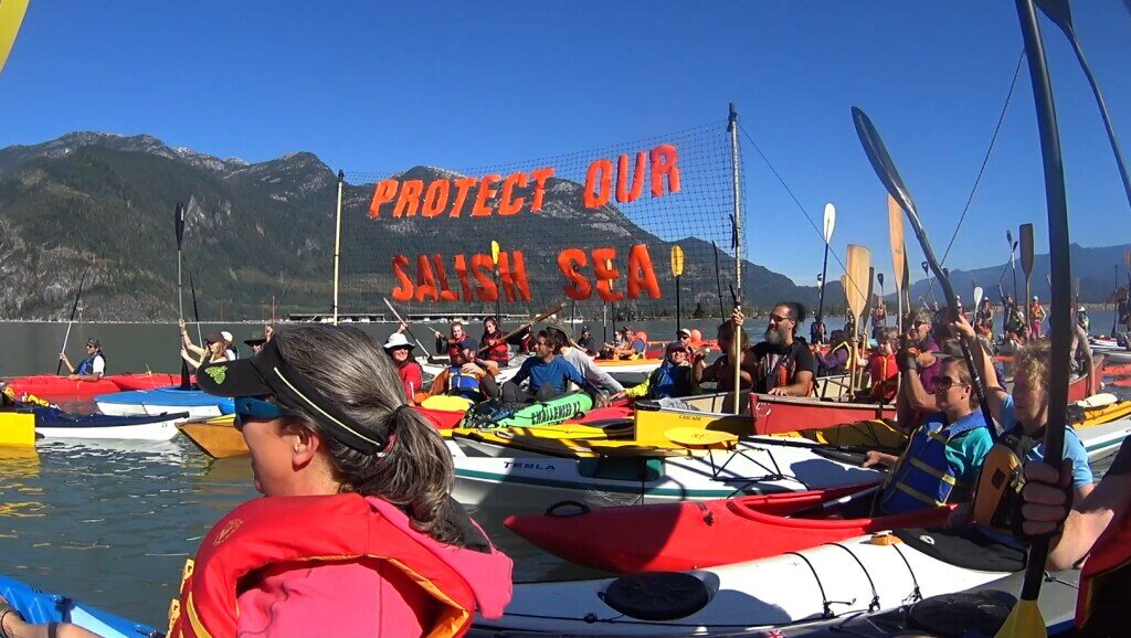 Kayaks at a rally to protect Salish Sea